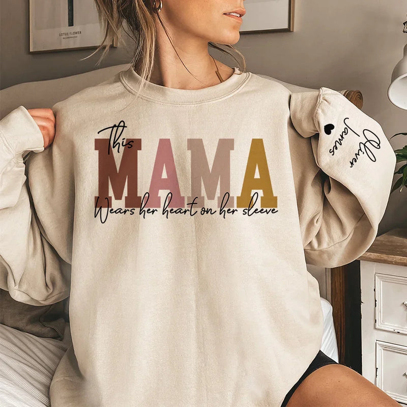 This Mama Wears Her Heart On Her Sleeve - Family Personalized Custom Unisex Sweatshirt, Hoodie With Design On Sleeve - Christmas Gift For Mom, Grandma