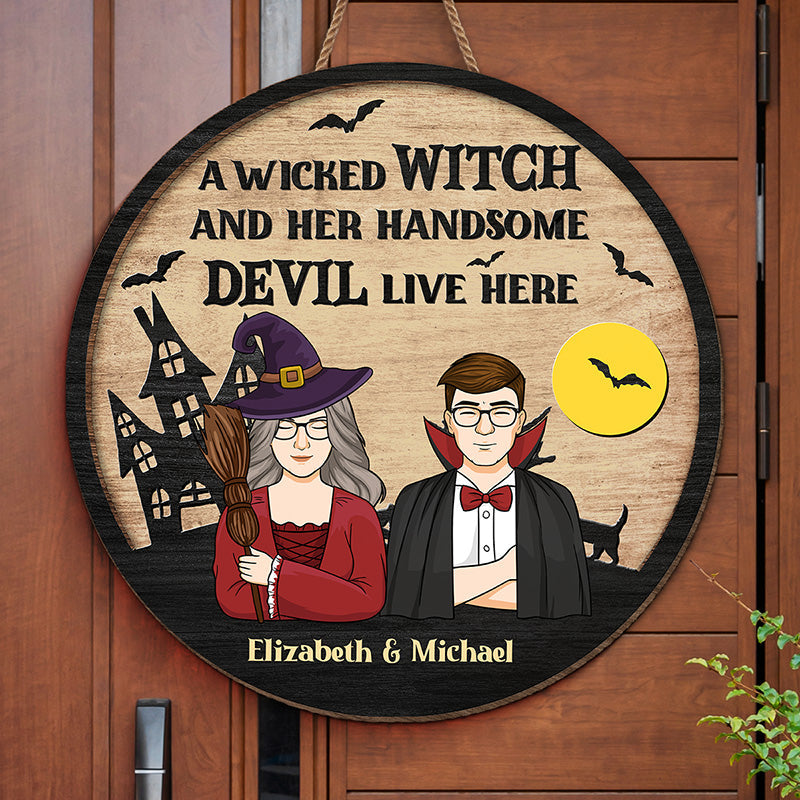 A Wicked Witch And Her Handsome Devil Live Here - Couple Personalized Custom Round Shaped Home Decor Witch Wood Sign - Halloween Gift For Witches, Husband Wife